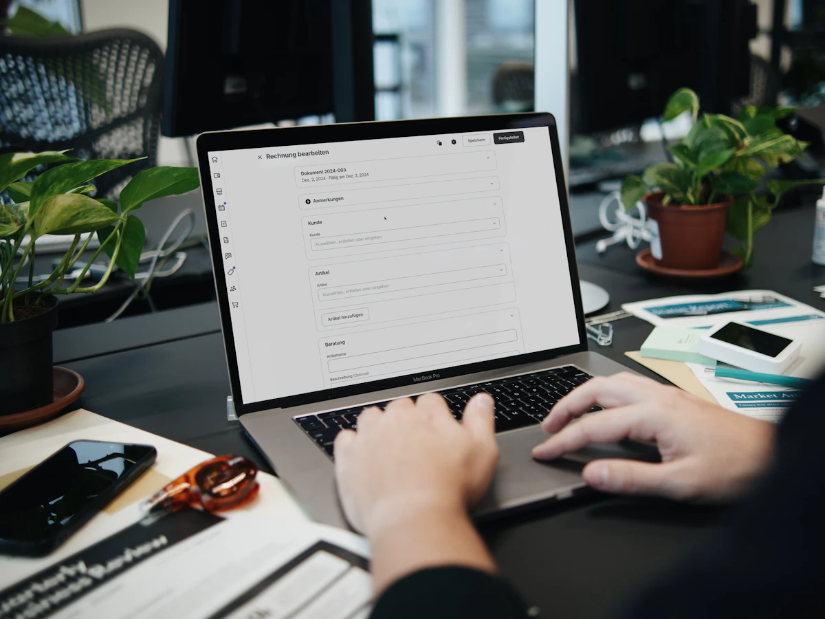 Person reviewing information on a laptop at a desk; illustrative stock photo